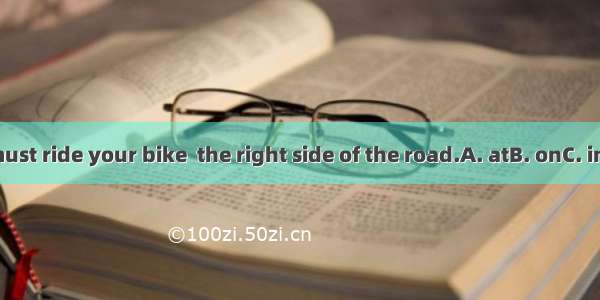 You must ride your bike  the right side of the road.A. atB. onC. inD. for